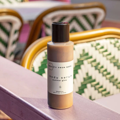 Golden shimmer body serum for radiant summer glow